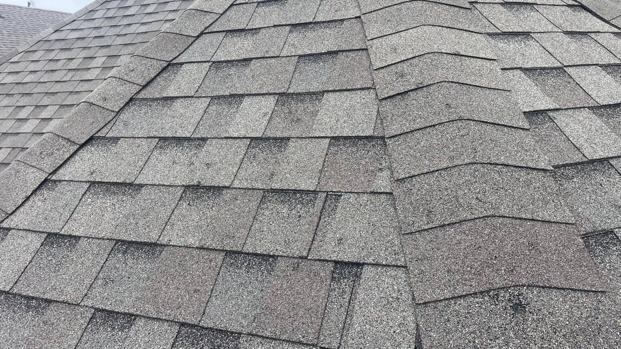 close up of damage of a grey roof